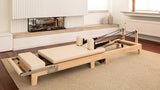 Pilates reformer met verstelbare veren en footbar