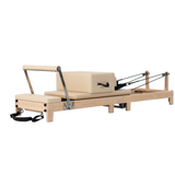 Luxe Pilates reformer van massief eikenhout voor thuisgebruik